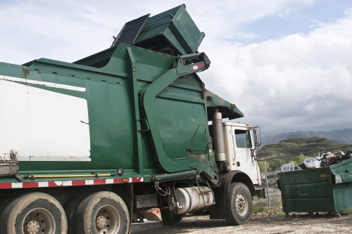 Business team managing waste with a skip