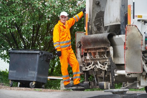 Waste being loaded into a lockable skip